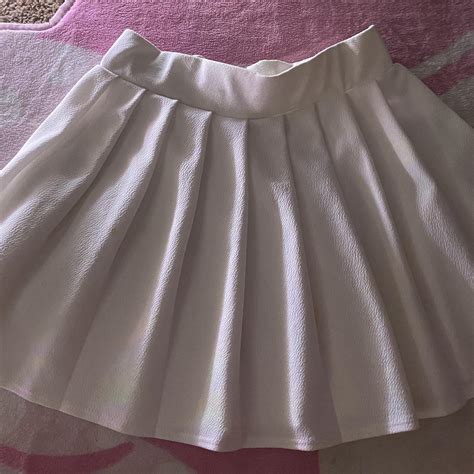 White golf skirt, small stains. Size small-medium... - Depop