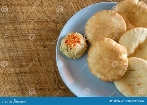 Tasty Mini Pita Bread with Humus on Rustic Wood Stock Image - Image of ...