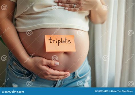Pregnant Woman Holding Belly with Triplets Sign Expecting Three Babies ...