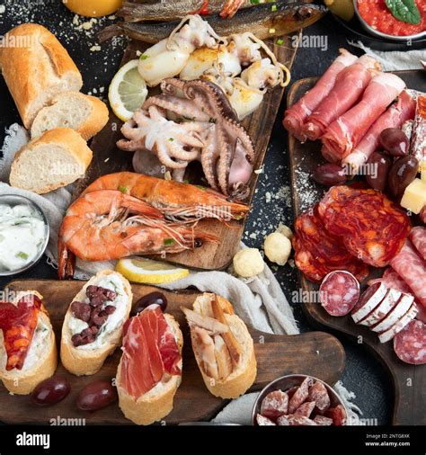 Typical spanish tapas with jamon slices, chorizo, salami, olives ...