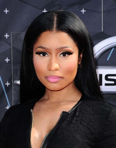 Download Nicki Minaj stands with confidence in a vibrant pink outfit ...