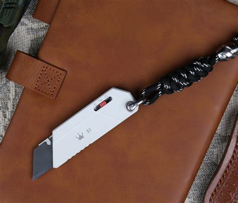 This CNC-Machined Utility Knife Deploys with Gravity