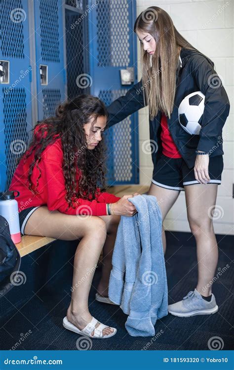 Two Soccer Teammates in a Locker Room Console Each Other after a Loss ...