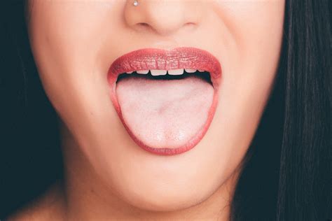 White Bump on Tongue Due to Piercing or Papillae