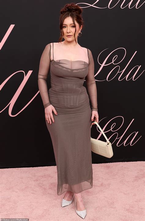 Selena Gomez flashes the flesh in a PLUNGING chic trouser suit as she ...