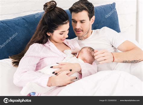 Woman Breastfeeding Husband