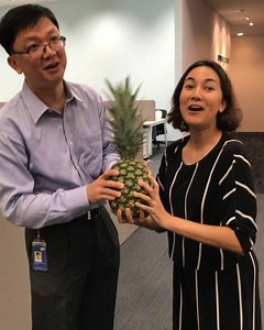 Huat ah! SPH Magazines CEO Loh Yew Seng and Senior Features Writer Natalya Molok do the pineapple jam to usher in good tidings and prosperity as we open our doors to our new Toa Payoh office. | The Singapore Women's Weekly