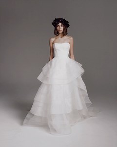 This romantic #VeraWangBride wedding dress features a stretch crepe corset bodice featuring a dramatic tiered ruffle princess skirt! https://bit.ly/3tg6yhH | Designer Bridal Room, Hong Kong