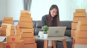 Woman with packing box ready for shipping
