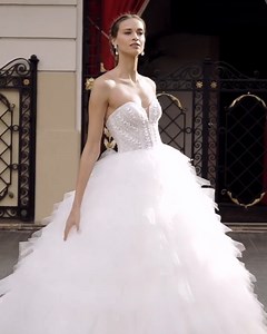 This fairytale #AireDiamond wedding dress features a flattering strapless bodice adorned with sparkly beadwork featuring a dreamy ruffle princess skirt. Discover the style: https://bit.ly/3yRDWxr #租婚紗 | DBR Weddings | Facebook
