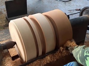 The table is from a large tree trunk | Sculpture