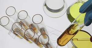 Scientist working in the laboratory with motor oil in a test tube