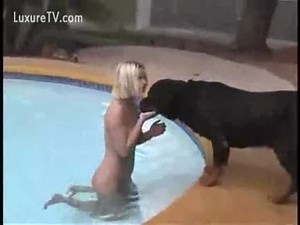 Wife enjoys a little bestiality fun while swimming nude with her dog
