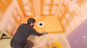 Shower tray installation tips...always important to understand how waterproofing will affect tile work | Home Repair Tutor