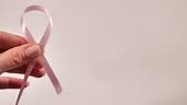 Breast Cancer disease symbol with pink ribbon on white background...