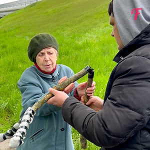 Empathetic man blesses a woman with handmade wooden crutches. | Tips & Tricks