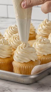 Ok. Let me explain. I recently changed my vanilla cake recipe. It uses the hot milk method which helps gelqtenise the starch in the flour which locks in moisture. Kind of how boiling water works in a moist chocolate cake. It gives you a soft sponge that stays moist for days. And the flavor is out of the this world. So then I thought, i wonder if this would work in a cupcake. It didn’t at first. It was close but it needed tinkering and then I cracked it and it was glorious. It’s a bloody soft cup