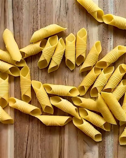 The dough is rolled over a textured board to give the pasta its distinctive grooves 🤩🍝 | FOODbible
