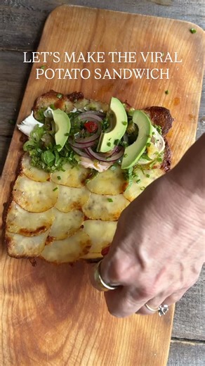 I love this viral potato sandwich. I thinly sliced potatoes, overlapping them on a parchment paper covered baking sheet in four rows of six. I added olive oil, salt and pepper, and plenty of shredded mozzarella. Bake at 400 degrees for 25 minutes (depending on the thickness of the potato slices), or until the cheese is golden and bubbling, then remove and let cool slightly. I filled mine with my Pistachio Pesto, Sizzling Everyday Roast Chicken Breast, avocado, Chicago-style giardiniera, beautifu