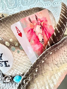 3.7K views · 22 reactions | So, in true DIY fashion, I gave myself 2nd degree burns with a hot glue gun while attaching feathers and my fine art cards to my cowgirl hats.  Let me tell ya, the burns sting like crazy, but hey, at least my hats are adorable! Sometimes art is pain... literally! But I’m still struttin’ around with my cute cowgirl hats and a whole lot of pride (and aloe). #cowgirlhat #cowgirlfashion | Tipsy Artist | Facebook