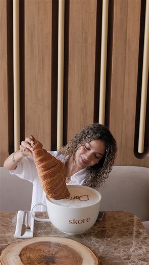 Skore on Instagram‎: "اكبر كرواسون وصل جدة ومايحلى غير مع اكبر كابوتشينو Biggest croissant in Jeddah? Only at Skore — with the biggest cappuccino too ☕縷 #SkoreYourDay #SkoreJeddah #JeddahEats #AllDayDining #CroissantLovers #CafeVibes #WeekendEats #سكور #يومك_بأحلى_سكور"‎