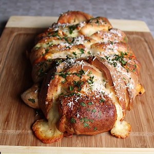 Ingredient: 2 tubes Pillsbury dinner rolls 6 ounces spaghetti, cooked and slightly cooled 1 cup thick spaghetti sauce 8 ounces mozzarella cheese, cut into 1/2-inch cubes 1 egg white, beaten Parmesan cheese Fresh parsley Directions: Preheat oven to 350 degrees. Prepare a large baking sheet with nonstick spray. Prepare work surface with a light coating of nonstick spray. Roll dinner rolls into a rectangle, approximately 12x16-inches in size. Cover well with plastic wrap and let rest 10-15 minutes.