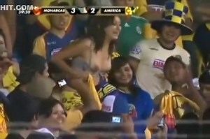 Sexy soccer fan flashes fans by accident