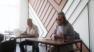 Adult students using devices in classroom | Free Stock Video Footage