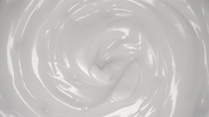 Abstract Swirling White Liquid Background