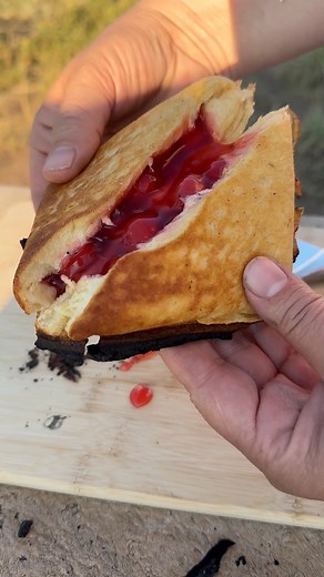 Cooking pudgie pies on the campfire — fill them with your favorite pie filling, and you have a delicious camping dessert! #campingfood #campfirecooking #camping #outdoorcooking | Forest Auntie