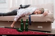 drunk sleeping man stock sofa room alamy living