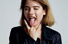 tongue girl sticking teen sign horns