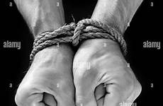 captive prisoner tied hands male rope stock bound restrained har001 clinched fists alamy 1940s wrist hars heavy