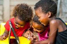 african kids having fun tablet threesome stock depositphotos