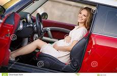 car girl pregnant red brunette her driving woman baby beautiful young stock long