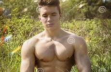 shirtless young nature hunk man muscular muscle outdoor handsome body sitting grass looking