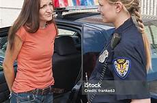 handcuffed police woman female officer car stock istock adult next