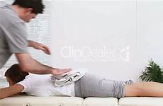 pelvis massaging physiotherapist