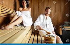 sauna couple relaxing sweating resting stock