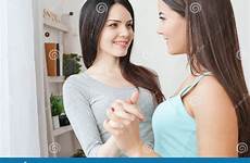 hands holding lesbian bedroom couple happy standing women two smiling young each other