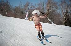 naked skiing china ski carnival man skis pig getty peek take wig zhang tao heilongjiang northeast province wearing during