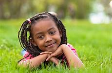 girl young smiling african little girls outdoor cute portrait stock down long pe outside hairstyles grass school child people pediatrics