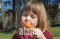 portrait lolly ice stock licking girl lips alamy enjoying eating colorful child blonde three years old similar