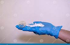 condom sperm latex glove protect doctor hand background used blue pregnancy protection against