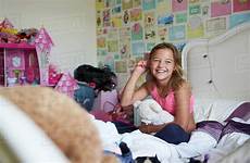 girl bed sitting hair bedroom smiling brushing stock dissolve guerilla
