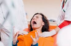 dentist patient screaming pain dental office woman preview