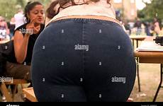 bending over woman overweight alamy shopping