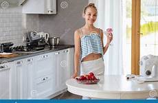 teen kitchen drinking smoothie fruit pretty young sunlight blender happy