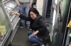 floor woman city peeing york bodega video peed her kicked emerged shocking moment showing has