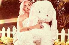 miley bunny cyrus easter spanked gets shoot racy naughty very posed stunner giant she also rabbit stuffed church sultry braless